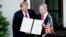 U.S. -- U.S. President Donald Trump (L) and Israeli Prime Minister Benjamin Netanyahu hold up a Golan Heights proclamation outside the West Wing after a meeting in the the White House in Washington, March 25, 2019