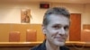 Россиянина Александра Винника вывезли из Греции в США, где ему грозит 50 лет тюрьмы