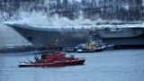 RUSSIA -- Smoke rises from Russia's only aircraft carrier, the Admiral Kuznetsov, in Murmansk, December 12, 2019