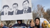 KYRGYZSTAN -- Protestors hold posters during an anti-corruption rally in Bishkek, December 18, 2019