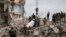 UKRAINE – Rescuers extract a body from a residential building damaged by a Russian military strike, amid Russia's invasion on Ukraine, in the town of Chasiv Yar, in Donetsk region, July 10, 2022