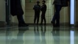 RUSSIA -- Police officers stand in a hallway of a business center, which houses the office of opposition leader Aleksei Navalny's Anti-Corruption Foundation (FBK), in Moscow, January 27, 2021
