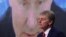 RUSSIA – Kremlin spokesman Dmitry Peskov sits in front of a screen displaying Russian President Vladimir Putin addressing his annual press conference via a video link. Moscow, December 17, 2020 