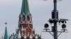 RUSSIA --Surveillance cameras on a lamppost in central Moscow, with Troitskaya Tower of Kremlin behind