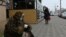 RUSSIA -- A woman wearing a protective face mask begs for money, amid the outbreak of the coronavirus disease (COVID-19) in Omsk, October 30, 2020