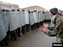 A demonstrator in St. Petersburg shouts at riot police during an unauthorized rally for the release of jailed opposition leader Aleksei Navalny on January 31, 2021.