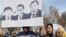 KYRGYZSTAN -- Protestors hold posters during an anti-corruption rally in Bishkek, December 18, 2019