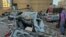 TOPSHOT - People check the wrecakge of cars damaged in an Israeli air strike in the southern Beirut suburb of Haret Hreik on March 2, 2026.