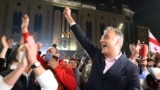 Former TV news anchor Zaal Udumashvili, one of the leaders of the United National Movement party, cheers as party supporters gather in front of Georgia's parliament building to "monitor" the vote count in the country's October 31, 2020 parliamentary election.