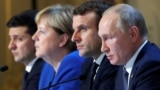 Talking about talking peace: Ukraine's President Volodymyr Zelenskiy, German Chancellor Angela Merkel, French President Emmanuel Macron, and Russia's President Vladimir Putin attend a press conference after their December 9 summit. 