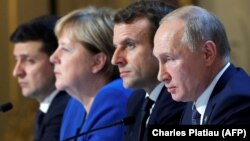 Talking about talking peace: Ukraine's President Volodymyr Zelenskiy, German Chancellor Angela Merkel, French President Emmanuel Macron, and Russia's President Vladimir Putin attend a press conference after their December 9 summit. 