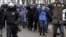 RUSSIA – Detained protesters walk escorted by police during a protest against the jailing of opposition leader Alexei Navalny in St. Petersburg, January 31, 2021