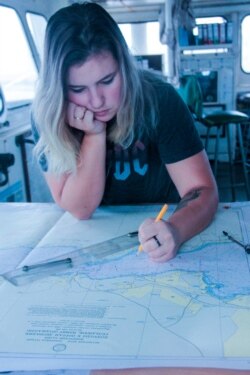 Elena Gudz plots a navigation course. Photo: Elena Gudz archive