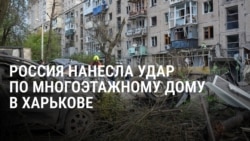 "Мужа убило... Суки проклятые". Жительница Харькова смотрит на тело супруга, погибшего от российского удара