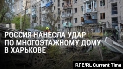 "Мужа убило... Суки проклятые". Жительница Харькова смотрит на тело супруга, погибшего от российского удара