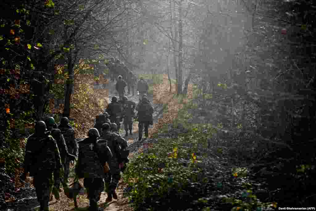NAGORNO-KARABAKH -- Military volunteers walk on a forest road in the Shushi (Susa) region, October 31, 2020