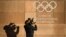 FRANCE -- A television cameraman films the logo of the International Olympic Committee (IOC) at its headquarters in Pully, near Lausanne, prior to an executive meeting on December 5, 2017.