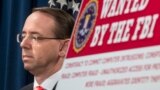 U.S. -- U.S. Deputy Attorney General Rod Rosenstein speaks at a news conference with other law enforcement officials at the Justice Department to announce nine Iranians charged with conducting massive cyber theft campaign, in Washington, March 23, 2018