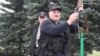 BELARUS -- Belarusian President Alyaksandr Lukashenka holds an automatic rifle and wearing body armor as he arrives at his residence in Minsk, August 23, 2020