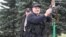 BELARUS -- Belarusian President Alyaksandr Lukashenka holds an automatic rifle and wearing body armor as he arrives at his residence in Minsk, August 23, 2020