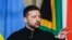 Ukraine's President Volodymyr Zelensky gestures as he speaks at a joint press conference with unseen South Africa's President Cyril Ramaphosa during an official visit by Zelensky to South Africa, at the Union Buildings in Pretoria on April 24, 2024. (Phot