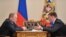 RUSSIA -- Russian President Vladimir Putin (L) and Pskov region governor Andrei Turchak meet for talks at Novo-Ogaryovo residence, December 16, 2013
