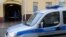 Russia -- A police car is parked outside the offices of former oil tycoon Mikhail Khodorkovsky's Open Russia foundation in Moscow, April 16, 2015