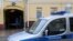 Russia -- A police car is parked outside the offices of former oil tycoon Mikhail Khodorkovsky's Open Russia foundation in Moscow, April 16, 2015