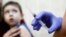 RUSSIA -- A child is vaccinated against measles in Moscow, March 1, 2019