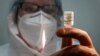 RUSSIA -- A nurse prepares Russia's "Sputnik-V" vaccine against the coronavirus disease (COVID-19) for inoculation at a clinic in Tver, Russia October 12, 2020. 