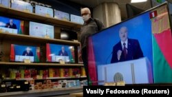 Belarusian President Alyaksandr Lukashenka is seen on TV screens at a Minsk electronics store on August 4, 2020 during his annual state-of-the-nation speech. 