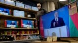 Belarusian President Alyaksandr Lukashenka is seen on TV screens at a Minsk electronics store on August 4, 2020 during his annual state-of-the-nation speech. 