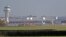 I.K. -- A police vehicle stands on the closed runway at Gatwick Airport after drones flying illegally over the airfield forced the closure of the airport, in Gatwick, December 20, 2018