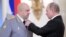 RUSSIA -- Russian President Vladimir Putin (R) decorates Commander of the Russian troops in Syria Colonel General Sergei Surovikin (L) during a ceremony to present state awards to Russian military servicemen who fought in Syria, at the Kremlin in Moscow, 