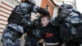 RUSSIA – Law enforcement officers detain a man after a rally to demand authorities allow opposition candidates to run in the upcoming local election in Moscow, Russia August 10, 2019