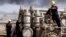 FILE - In this Dec. 13, 2009 file photo, Iraqi workers are seen at the Rumaila oil refinery, near the city of Basra, 340 miles (550 kilometers) southeast of Baghdad, Iraq.