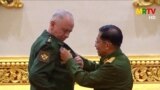 BURMA -- Russian Deputy Defense Minister Alekaandr Fomin (L) receives a medal from Myanmar armed forces chief Senior General Min Aung Hlaing in Naypyidaw, March 26, 2021