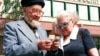Russia -- a man and a woman count money in front of the Sberbank in Moscow on July 30, 1998