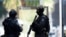 Australia - Members of the New South Wales (NSW) Police Force Public Order and Riot Squad (PORS) are seen outside a Lindt cafe in Martin Place in the central business district of Sydney, 15 December 2014