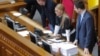 UKRAINE -- Yulia Tymoshenko (2-R), Leader of Batkivshchyna (Motherland) party, occupies the speaker's place as Ukrainian lawmakers clash as part of them try to block the podium during a hearing for opening a land market, at the Parliament in Kyiv, Februar