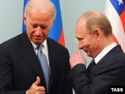 Then-Prime Minister Vladimir Putin (right) meets with then-U.S. Vice President Joe Biden in Moscow in March 2011.