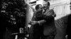 John Steinbeck (right) and Oleksandr Korneichuk, head of the Ukrainian Union of Writers, exchange hugs. Korneichuk was an informant, according to KGB documents.