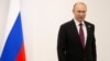 JAPAN -- Russian President Vladimir Putin stands prior to his talks with South African President Cyril Ramaphosa on the sidelines of the G-20 summit in Osaka, western Japan, Friday, June 28, 2019.