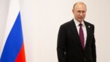 JAPAN -- Russian President Vladimir Putin stands prior to his talks with South African President Cyril Ramaphosa on the sidelines of the G-20 summit in Osaka, western Japan, Friday, June 28, 2019.