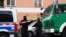 GERMANY -- Armed police officers stand behind a cordon during a raid at the Al-Irschad association in Berlin, Germany, 30 April 2020. 