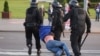 BELARUS -- Belarusian law enforcement members detain a man during an opposition protest following the inauguration of Belarusian President Lukashenka in Minsk, September 23, 2020