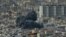Smoke rises from the site of an Israeli strike in southern Beirut on March 28, 2025.