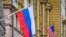 RUSSIA -- A Russian flag flies next to the U.S. embassy building in Moscow on March 18, 2021