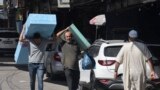 Palestinians carry mattres to displaced from Gaza arrive his house in Rafah refugee camp southern of Gaza Strip , on Octobers 15 2023