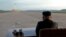 North Korean leader Kim Jong Un watches the launch of a Hwasong-12 missile